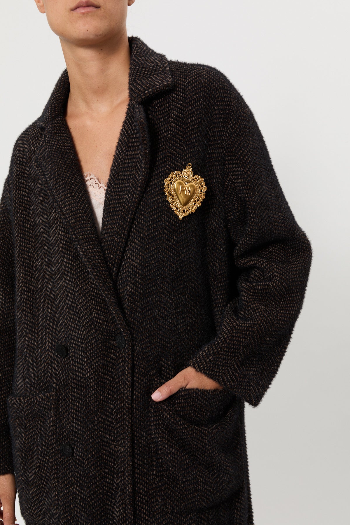FUR COAT WITH JEWEL BROOCH