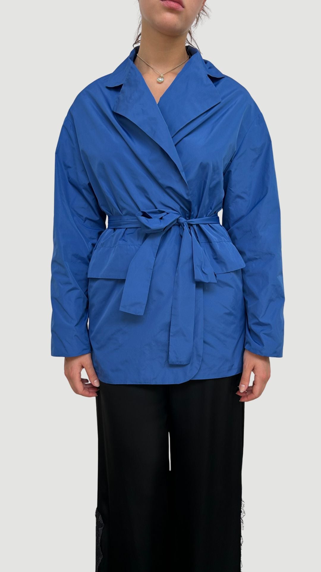 WINDPROOF TAFFETA JACKET WITH BELT AND JEWEL BROOCH